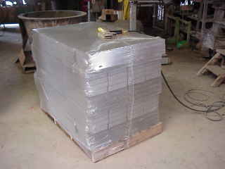 Shrink wrapped pallet of bricks.