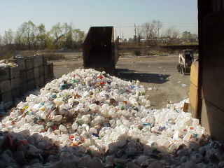 Truck dropping off mixed recyclables.