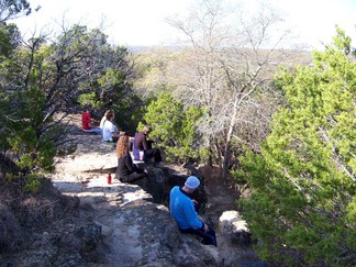 Meditating at top of hill.
