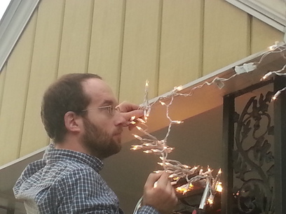 David Installing Christmas Lights.
