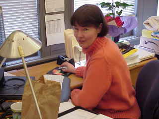 Ann at her old desk.