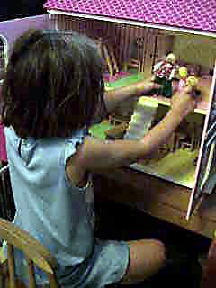 Ava and doll house.