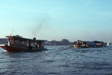 Tug boat and rice barge.