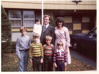 Kelly with Sandy and Bill and her brothers.
