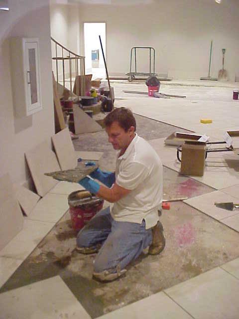 Sammy Laying Ceramic Tiles.