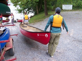 Unloading canoes.