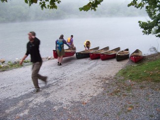 Canoes at boat ramp.